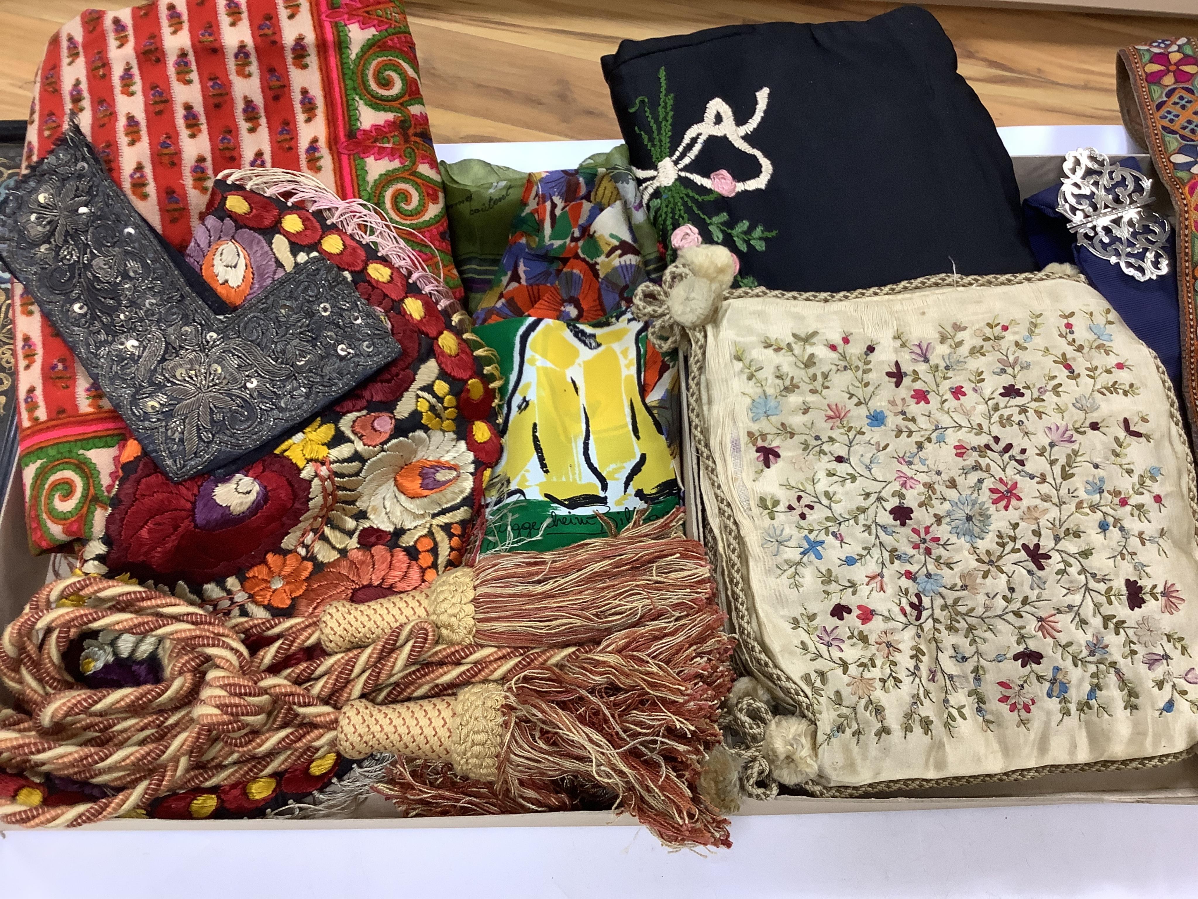 A collection of textiles: a ribbon work hankie and pyjama case, a metalwork collar, a coloured printed shawl, a nurses belt and embroidered belt, an advertising Guggenheim Bilbau hankie etc (10). Hankie case 22cm square.
